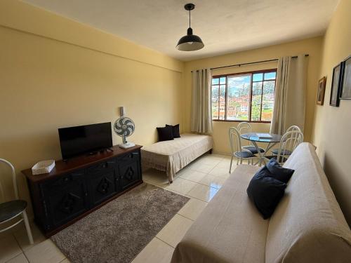 TV a/nebo společenská místnost v ubytování Apartamento 1 quarto Aconchegante em Águas de Lindóia