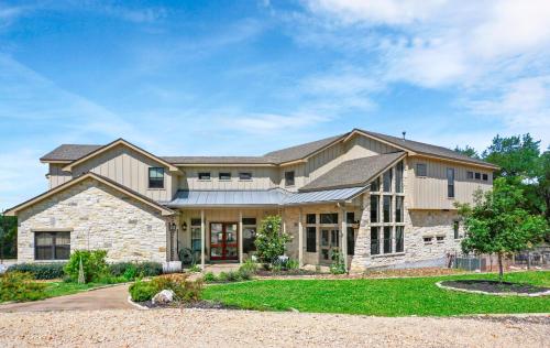 a large house with a stone at Paloma Ridge in Fourth Crossing
