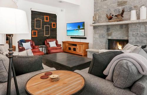 a living room with a couch and a fireplace at Paloma Ridge in Fourth Crossing