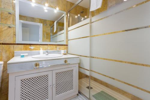 a bathroom with a sink and a mirror at 3D MTR - Marbella Temporary Rent Two Bedrooms Apartment Marbella Old Town in Marbella