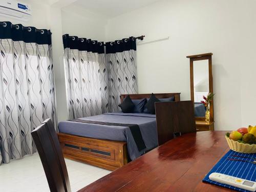 Ένα ή περισσότερα κρεβάτια σε δωμάτιο στο Villa Mangofera