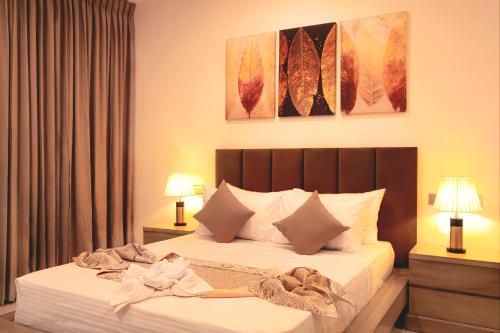 Ένα ή περισσότερα κρεβάτια σε δωμάτιο στο Ravo Hotel