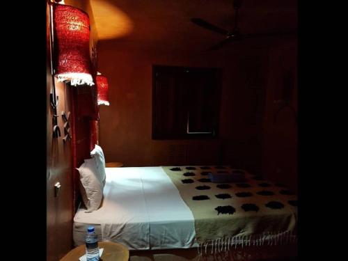 a bedroom with a bed in a room at Terres d'Amanar in Tahannout