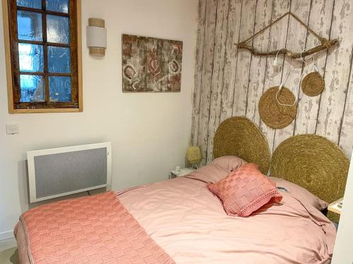 Postel nebo postele na pokoji v ubytování Appartement spacieux avec Jardin à 500 des plages