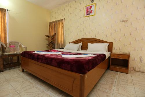 Postel nebo postele na pokoji v ubytování Rainbow Cottages-Budget Friendly rooms