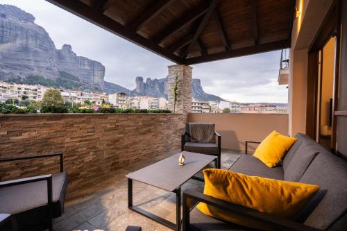 a living room with a couch and a table at Thea Petra in Kalabaka
