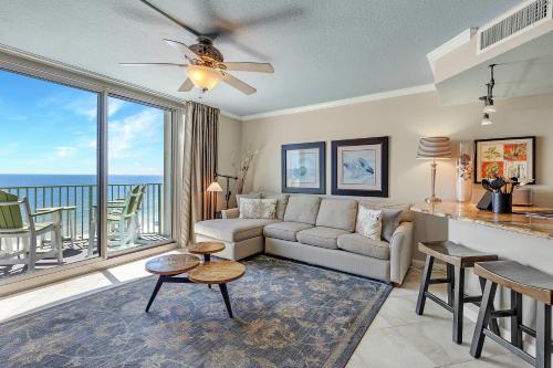 a living room with a couch and a table at Perdido Towers West 907 in Perdido Key