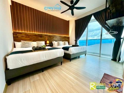 Postel nebo postele na pokoji v ubytování TheWave Residence By Heystay Management