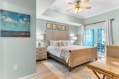 a bedroom with a bed and a ceiling fan at Phoenix West 1508 in Orange Beach