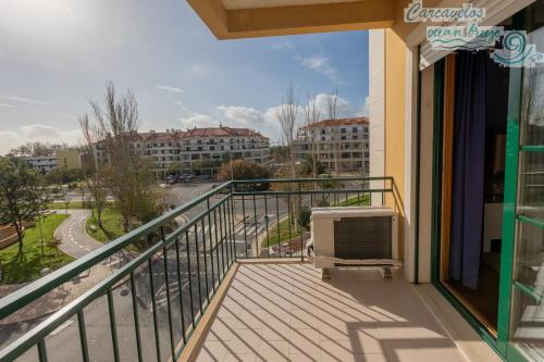 a balcony with a view of a city at Carcavelos Ocean Breeze in Carcavelos