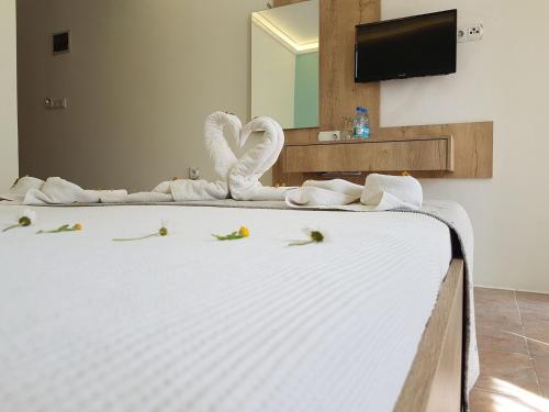 Postel nebo postele na pokoji v ubytování Tunacan Hotel