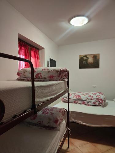 Ένα ή περισσότερα κρεβάτια σε δωμάτιο στο Casa Felice