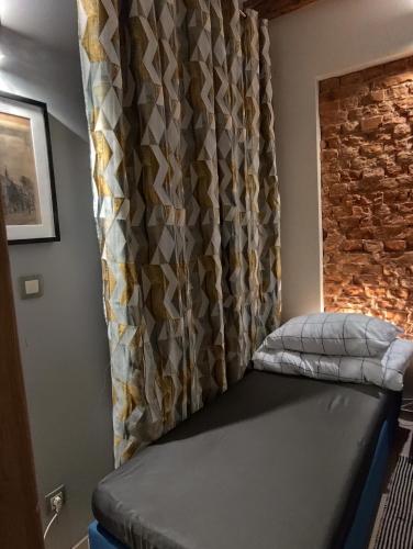 Postel nebo postele na pokoji v ubytování Apartament Deluxe w centrum Brzeska nr 2