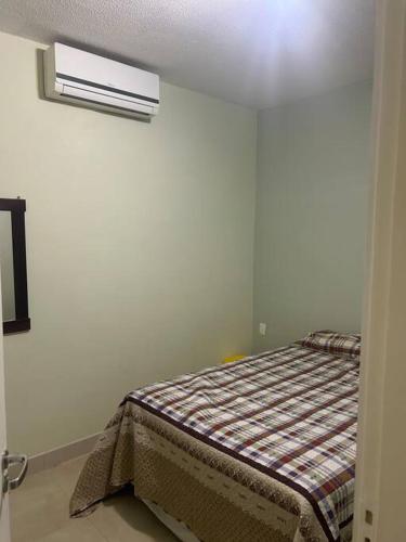 a bedroom with a bed in a room at Condominio Baleares,Marina Porto Itacuruca in Mangaratiba