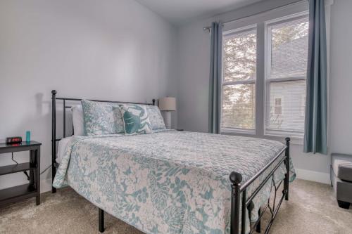 a bedroom with a bed and a window at Charlies Cove in Depoe Bay