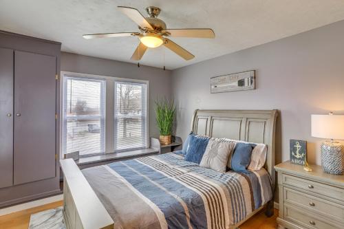 a bedroom with a bed and a ceiling fan at Walk to Beach Home with Pool in Vermilion in Vermilion