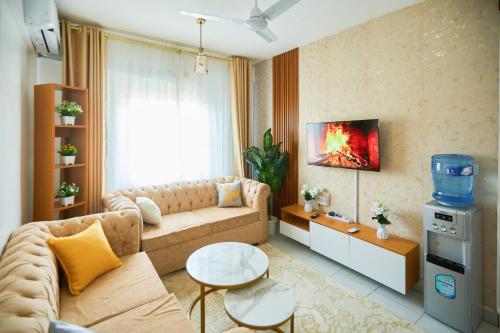 a living room with a couch and a fire pit at Buxton Point by Neema Havens 2 & 3 Bedroom in Mombasa