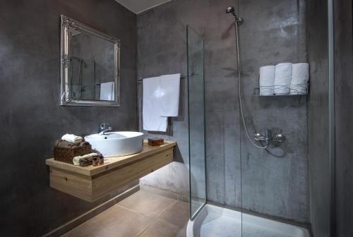 a bathroom with a sink and a shower at Senses Blue Boutique hotel in Hersonissos