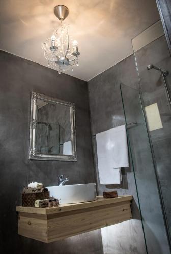 a bathroom with a sink and a mirror at Senses Blue Boutique hotel in Hersonissos