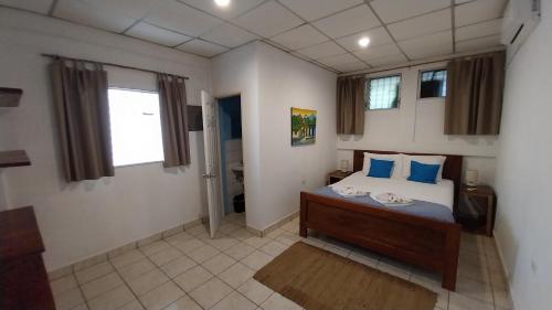 Ένα ή περισσότερα κρεβάτια σε δωμάτιο στο Casa Todo Bueno