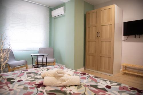 Ένα ή περισσότερα κρεβάτια σε δωμάτιο στο Sunflower Apartment Céntrico