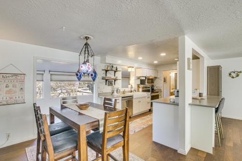 a kitchen and dining room with a table and chairs at Family Home with Games and Fenced Yard in South Ogden in South Ogden