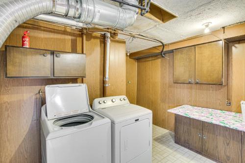 a washer and dryer in a kitchen with a counter at Family Home with Games and Fenced Yard in South Ogden in South Ogden