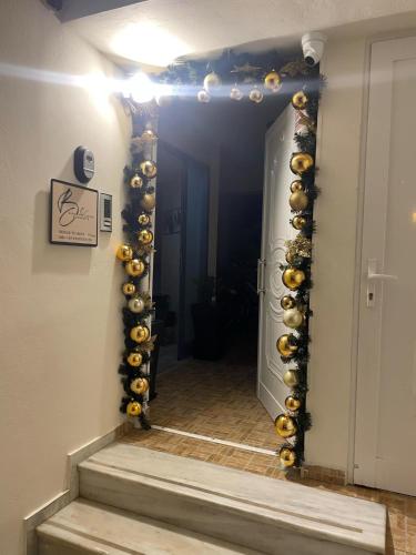 a hallway with a bunch of balls on a wall at BLUE CAVE LUXURY MAISONETTE View to the Corinthian Sea in Xylokastron