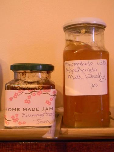 two jars of honey sitting on top of a shelf at Harbour Lights Guesthouse in Stranraer