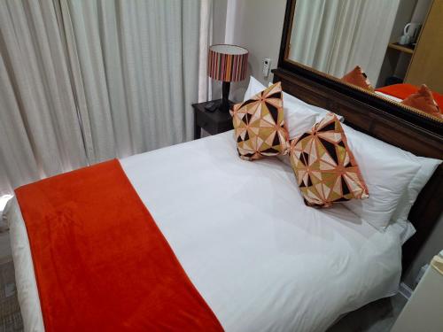 Ένα ή περισσότερα κρεβάτια σε δωμάτιο στο Melkbosstrand Bed and Breakfast