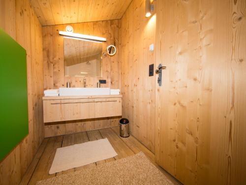 a bathroom with a sink and a mirror at Das Wiesegg in Fügenberg