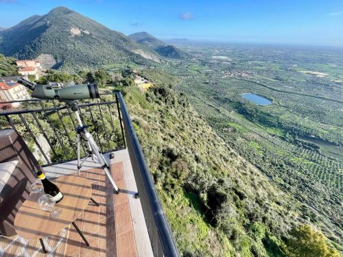 a camera on top of a building with a mountain at La Stalla e il Fienile suites viste mozzafiato in Norma