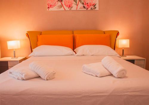 Postel nebo postele na pokoji v ubytování Divino Amore house of relax