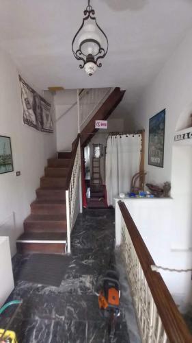 a room with stairs and a toy in the floor at CALABRIA COLLINA DI SCILLA CASALE OSTELLO1800 SELF SERVICE GIARDINO STANZE E APPARTAMENTI PER FAMIGLIE COPPIE E SINGLE Melia Pzza S Gaetano 16 in Castagnarella
