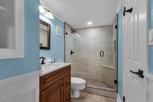 a bathroom with a toilet sink and a shower at Holiday Surf and Racquet Club 319 in Destin