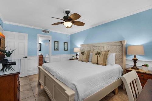 a bedroom with a bed and a ceiling fan at Holiday Surf and Racquet Club 319 in Destin