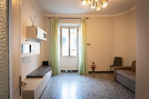 a living room with a couch and a window at Casa Livia in Genzano di Roma