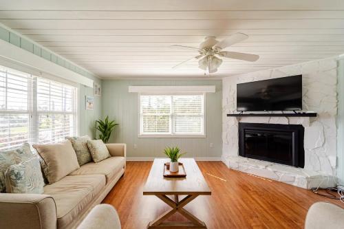 a living room with a couch and a fireplace at Private Rooms In Bradenton - Close to Sarasota in Bradenton
