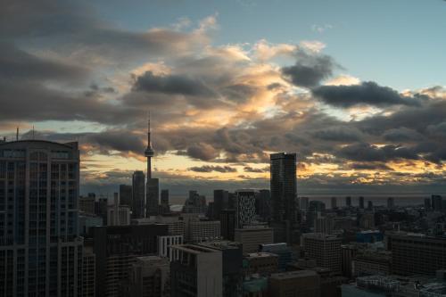 a view of a city skyline with the cn tower at 44th Floor, Panoramic Views, Bay Corridor Downtown Toronto Condo in Toronto