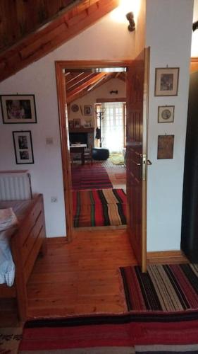 a room with a door open to a room with a hallway at Stone Mountainhouse near Kalavryta, North Peloponnese, Greece in Dhoumená