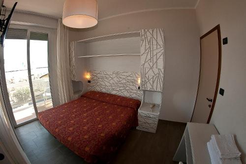 Postel nebo postele na pokoji v ubytování Hotel Alba D'Oro