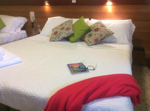 Una cama o camas en una habitación de Albergo Trattoria Fioravante