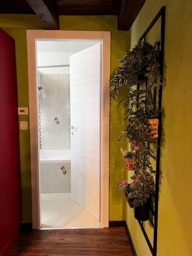 a hallway with a white door in a room at Maison Ama Charvensod in Charvensod