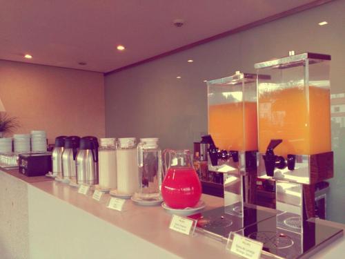 a counter in a store with a bunch of drinks at INLIMA Hotel & Spa in Ponte de Lima