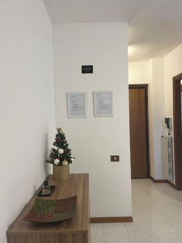 a room with a christmas tree on the wall at Pretty house in Rome