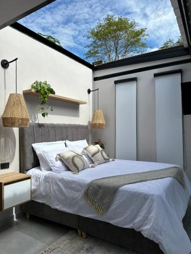 Postel nebo postele na pokoji v ubytování Cielo Abierto Cabaña Glamping