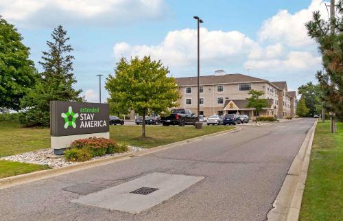 a street with a sign in front of a building at Extended Stay America Suites - Detroit - Madison Heights in Madison Heights