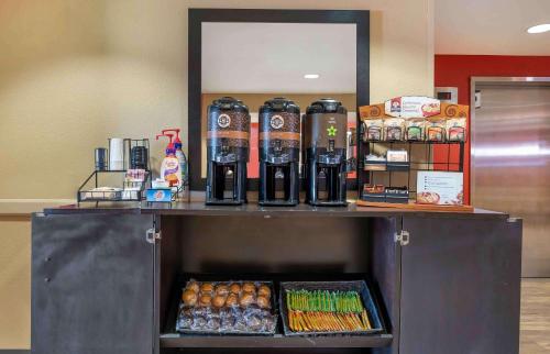 a counter with drinks and food on top of it at Extended Stay America Suites - Chicago - Buffalo Grove - Deerfield in Riverwoods