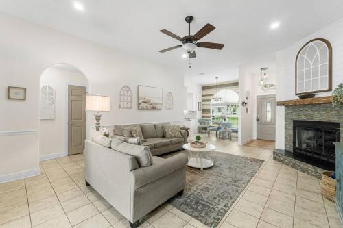 a living room with a couch and a fireplace at Making Memories in Panama City Beach