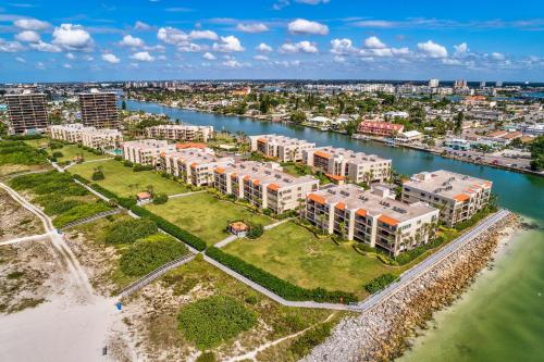 an aerial view of a resort complex next to a body of water at Land's End 11-203 Beach Front - Premier in St Pete Beach